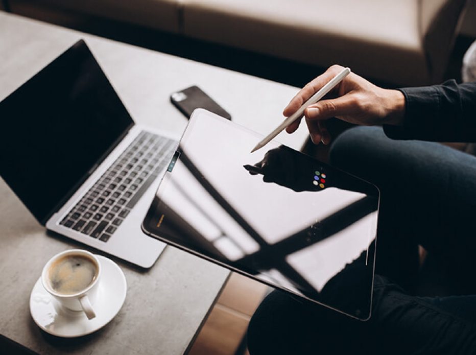 man-working-tablet-close-up-table (1)
